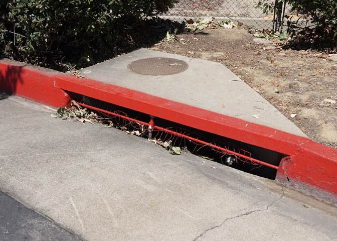 clogged curb inlet gutter